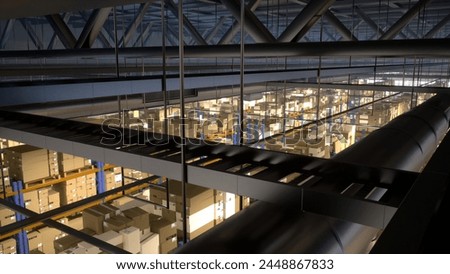 Massive storage facility loaded with goods and products, arranged on metal racks tagged with barcodes and identification labels. Warehouse handling shipping and sales activities. 