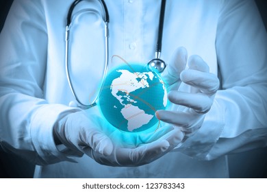 Medical Doctor Holding A World Globe In Her Hands As Medical Network