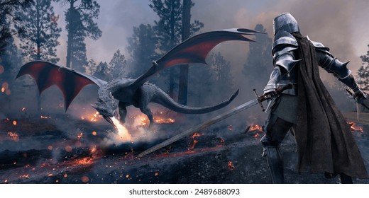 A medieval knight dressed in full period armour and cape standing with two swords drawn about to do battle with a dragon in a smoke filled forest with burning trees and charred wood on the ground.