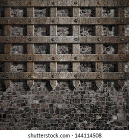 medieval old metal lattice on stone wall