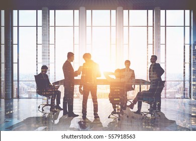 Meeting room. Group of businessmen around a table discussing work issues. Sunlight. 3d rendering. Toned image. Double exposure - Powered by Shutterstock