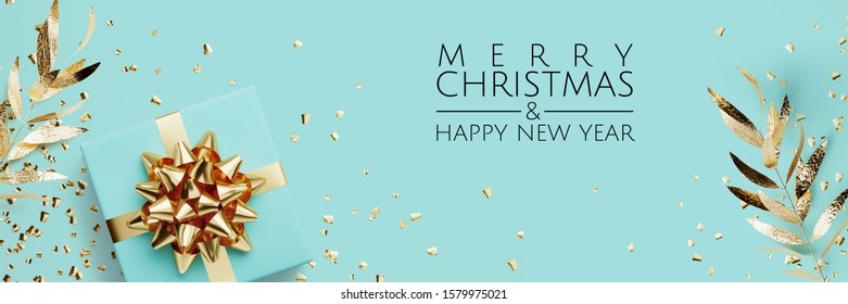 Merry Christmas and Happy New Year web banner. Blue gifts box, golden glitter and golden bow ribbon on blue background. 3d rendering illustration.