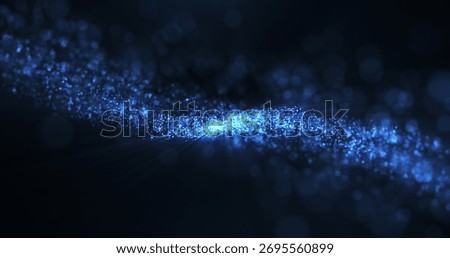 A mesmerizing display of blue light particles cascading across a dark background, creating a galaxy-like appearance with a sense of movement and depth.
