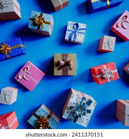 A meticulously arranged selection of vibrant, patterned gift boxes adorned with festive ribbons lie against a striking blue background, perfect for any celebratory occasion.
