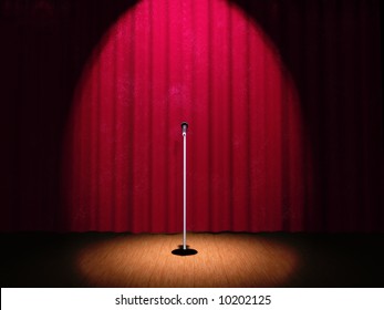 A Microphone On A Stage With A Spotlight On It.