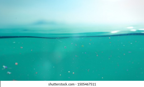 Microplastics Floating In Water, Underwater Micro Plastic Pollution (3d Illustration)