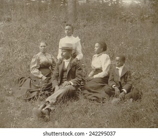 Middle class African American family seated on lawn in Georgia, ca. 1899.