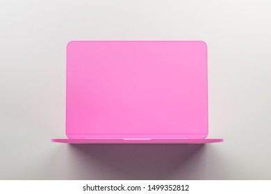Minimal concept with onepiece single material pink laptop at abstract light background. 3D Rendering