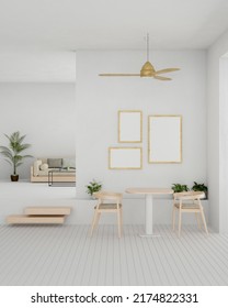 Minimal Scandinavian Home Living Room Interior Design With Comfortable Wood Sofa, Small Wood Dining Table Set, Indoor Plants, Frame Mockup On White Wall And Ceiling Fan. 3d Rendering, 3d Illustration