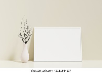 Minimalist and clean horizontal white poster or photo frame mockup on the floor leaning against the room wall with vase