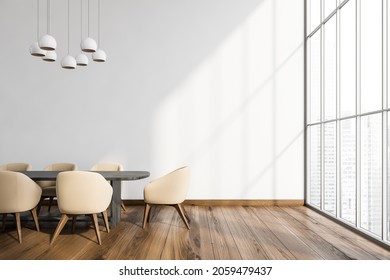 Minimalist Interior With Table, Beige Chairs, Floor To Ceiling Window And Lamp. Empty White Wall And Wide Wood Plank Floor. Concept Of Dining Room Design. 3d Rendering