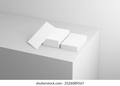 Minimalist white business card mockup on monochrome surface with clean stacked layout for modern branding and design

 - Powered by Shutterstock