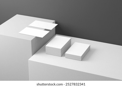 Minimalist white business card mockup on monochrome surface with clean stacked layout for modern branding and design

 - Powered by Shutterstock