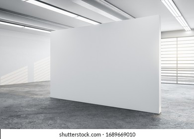 Minimalistic Concrete Gallery Interior With City View, Daylight And Blank Wall. Museum And Art Concept. Mock Up, 3D Rendering