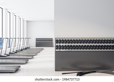 Minimalistic Gym Interior With Empty White Poster On Wall, Equipment And City View. Health And Lifestyle Concept. Mock Up, 3D Rendering