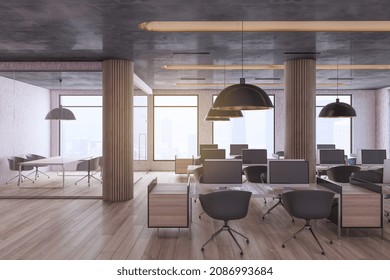Minimalistic Industrial Coworking Loft Office Interior With Furniture, Computer Monitors, Wooden, Flooring And Window With City View And Daylight. Workplace And No People Concept. 3D Rendering