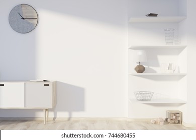 Minimalistic Living Room Interior With A Wooden Floor, A Clock On A White Wall, A Chest Of Drawers And Shelves In The Corner. 3d Rendering Mock Up