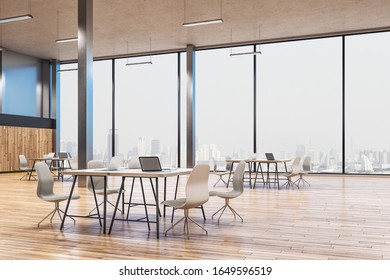 Minimalistic workplace interior with laptops on table and city view. Workplace and corporate concept. 3D Rendering