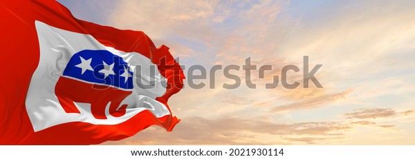 Minsk, Belarus - May, 2021:\
American Republican party, USA flag waving at sky background on\
sunset, panoramic view. copy space for wide banner. 3d\
illustration.