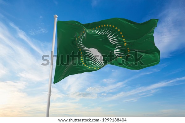 Minsk, Belarus - May, 2021: Flag of African\
Union waving in the wind at flagpole on background of blue sky. 3d\
illustration.