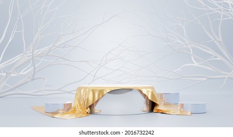 Mirror Podium Covered Gold Silk Fabric On Blue Background With White Branch Trees. Elegant Round Pedestal With Satin Cloth And Drapery, Empty Silver Stage For Display Product Realistic 3d Illustration