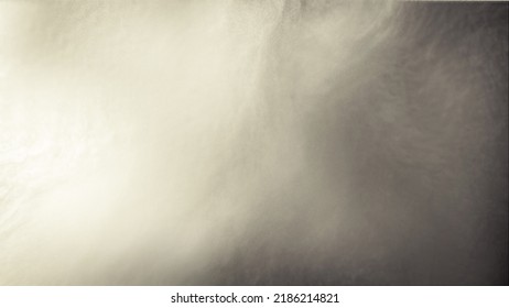 A mixed watercolor graphic background of golden mist or sunlight hitting golden-gray beige-toned dust particles.