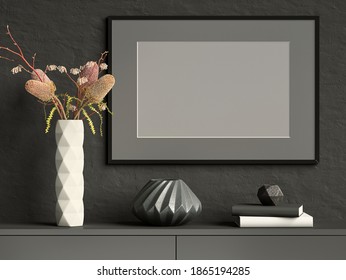 Mock Up Picture Frame On Black Plaster Wall With White Ceramic Vase With Flowers, Books And Geometric Pots; Stylish Poster Frame Dark Background; Landscape Orientation; 3D Rendering, 3D Illustration