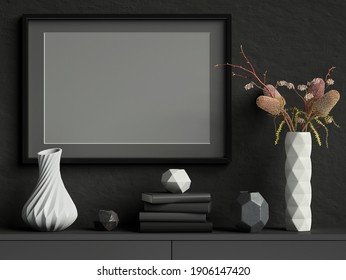 Mock Up Picture Frame On Black Plaster Wall With White Ceramic Vase With Flowers, Books And Geometric Pots; Stylish Poster Frame Dark Background; Landscape Orientation; 3D Rendering, 3D Illustration