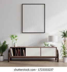 Mock up poster frame on cabinet in interior.3d rendering