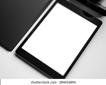 Mock up of tablet on the workspace. 3D rendering