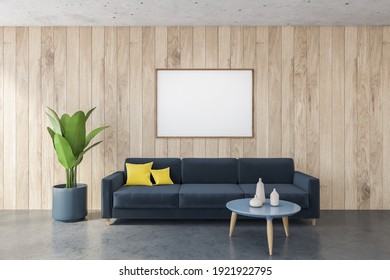 Mockup Canvas Frame Above Blue Sofa With Yellow Pillows In Black And Wooden Living Room, Wooden Wall. Minimalist Couch And Blue Coffee Table With Dishes, Plant, 3D Rendering No People