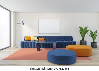 Mockup Canvas Frame In Beige Light Living Room With Large Blue Sofa With Pillows, Plants And Cushions On The Wooden Parquet Floor, 3D Rendering No People