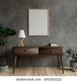 Mock-up photo frame in the living room on a concrete wall, with a lamp and a book on the wooden table and decorated with plants on the floor to the side.3d rendering
