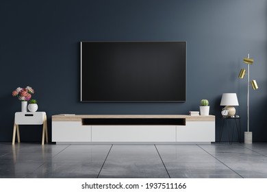 Mockup tv on cabinet in modern empty room with behind the dark blue wall.3d rendering