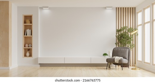 Mockup a TV wall mounted with armchair in living room with a white wall.3d rendering