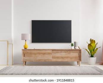 Mockup A TV Wall Mounted In A Living Room Room With A White Wall.3d Rendering