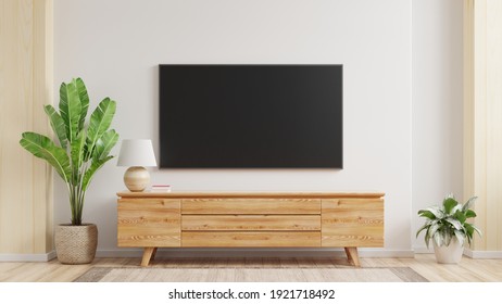 Mockup A TV Wall Mounted In A Living Room Room With A White Wall.3d Rendering