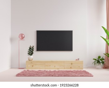 Mockup A TV Wall Mounted In A Living Room Room With A White Wall.3d Rendering