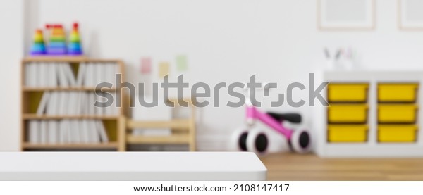 Modern baby\
kids playroom interior design with bookcase, bicycle and modern\
furniture. Copy space on tabletop over blurred playroom background.\
3d rendering, 3d\
illustration