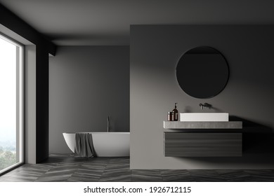 Modern Bathroom Interior With Sink And White Bathtub Near Window In Eco Minimalist Style. Wooden Floor. No People. 3D Rendering