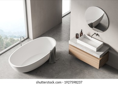 Modern Bathroom Interior With Sink And White Bathtub Near Window In Eco Minimalist Style. Top View. No People. 3D Rendering