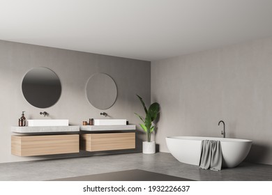 Modern Bathroom Interior With Two Sinks And White Bathtub In Eco Minimalist Style. Concrete Wall Empty Copy Space.No People. 3D Rendering.