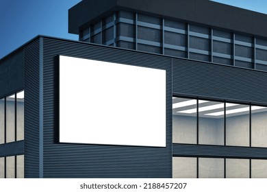 Modern Building Exterior With Empty White Mock Up Poster Billboard On Night Sky Background. Ad And Commercial Concept. 3D Rendering