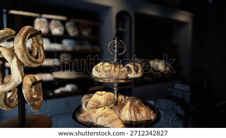 A modern cafe interior showcasing a table topped with two trays of delectable pastries.