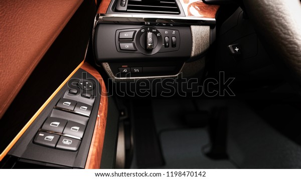 modern car\
interior view of the control panel lifting windows and turning on\
the headlights 3d render\
illustration