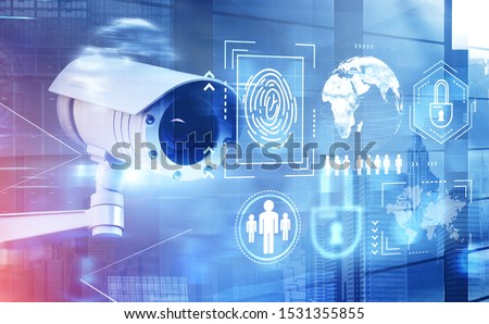 Modern CCTV camera over cityscape background with double exposure of cyber security interface. Concept of data protection. 3d rendering toned image. Elements of this image furnished by NASA