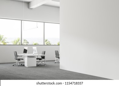 Modern Company Office Corner With White Walls And White Computer Desks. A Tropical View. 3d Rendering Mock Up