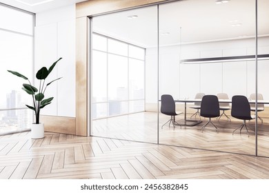 Modern conference room with empty table, chairs, and a plant, against cityscape background, concept of business meeting space. 3D Rendering - Powered by Shutterstock