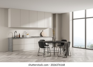 Modern design, using accent black details in beige, simple kitchen cabinet, panoramic window and parquet flooring. A concept of minimalist interior. Corner view. 3d rendering