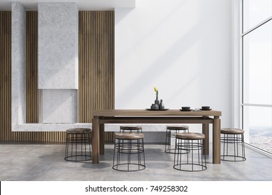 Modern Dining Room Interior With White And Wooden Walls, A Dark Wooden Table With Round Chairs Near It, A Loft Window And A Fireplace. 3d Rendering Mock Up